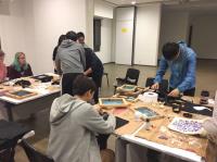 Students creating their resin wish bottles